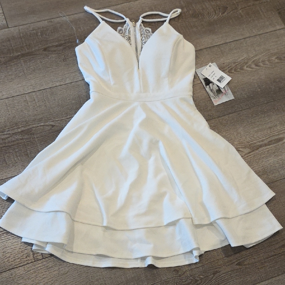 Ivory dress, decorative back.  Size M New w/tags.